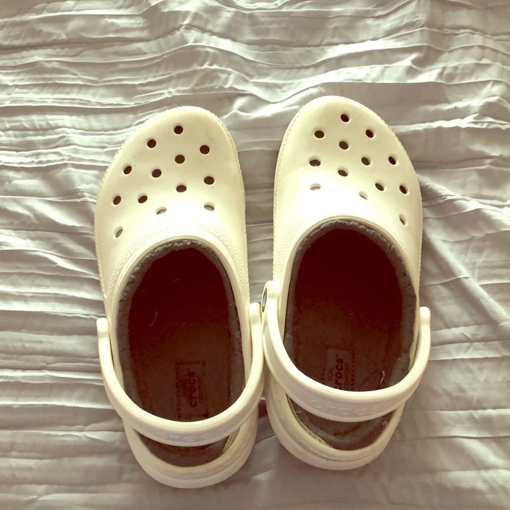 White fur lined crocs.